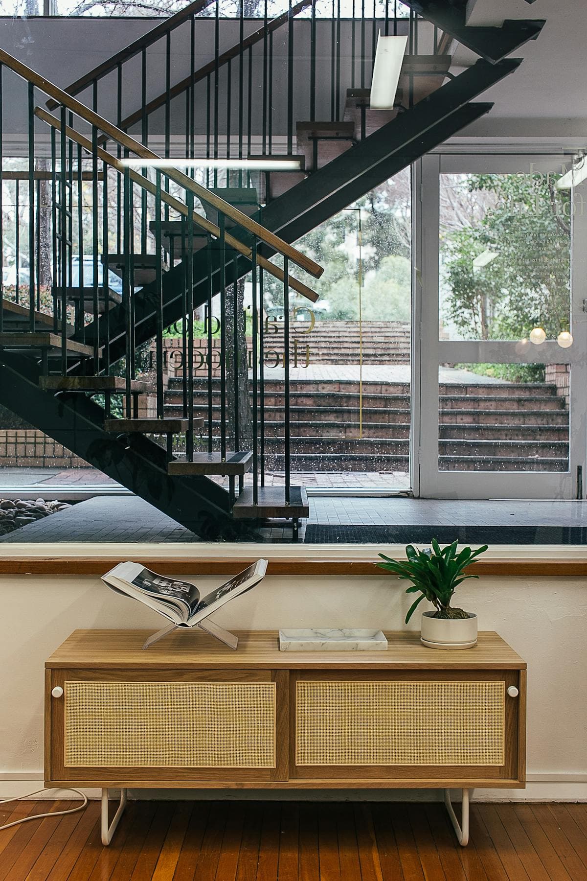 Real-oak sliding-door console beside an open-tread staircase, Castletown.